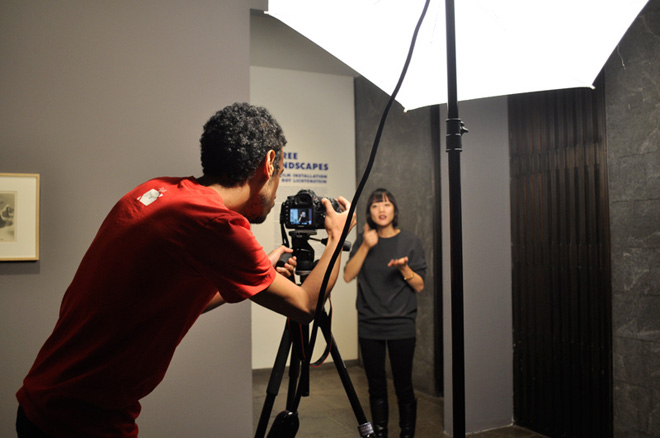 Videographer Pierce Jackson and art director Jeremy Lee Sanchez discuss the shoot with the assistance of an interpreter. Photo by Danielle Linzer.