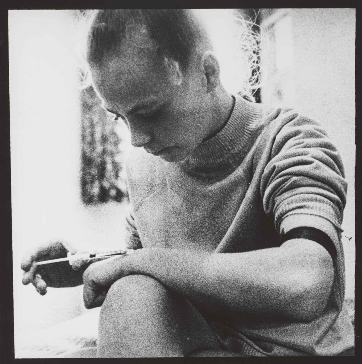Brian Weil, Woman Using a Clean Needle Provided by Liverpool Needle Exchange Program,  Liverpool, England, 1988