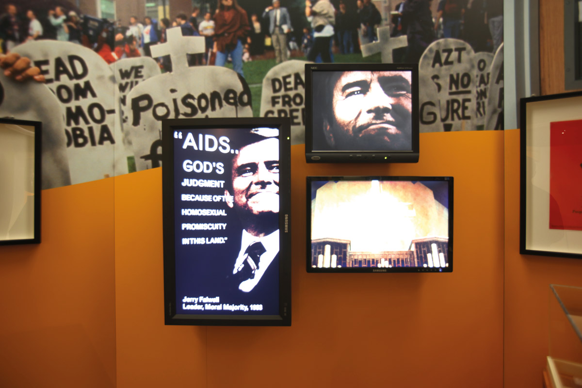 Multimedia installation in the gallery, showing homophobic quotes from politicians and public figures  alongside the rising death toll caused by AIDS. Courtesy of the National Library of Medicine.