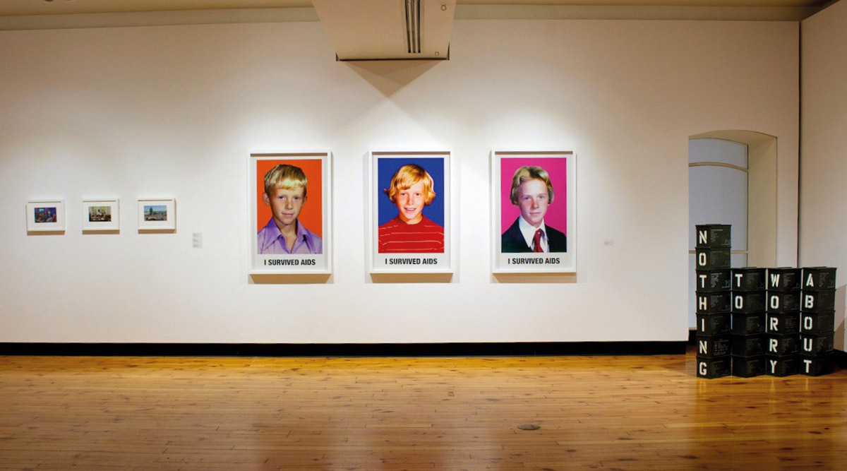 Installation view of The Queer Feeling of Tomorrow, Art Gallery of Guelph, Guelph, featuring Sunil Gupta’s SunCity, 2010,  John Hanning’s I Survived AIDS, 2015, and Shan Kelley’s Mostly Blanks, 2012. Courtesy of the Art Gallery of Guelph.